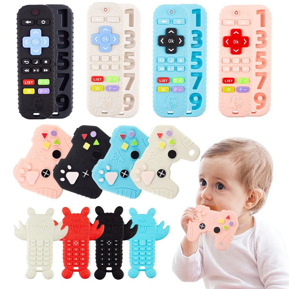 A collection of silicone baby teether toys in various colors and shapes, including a remote control design, being held by a b