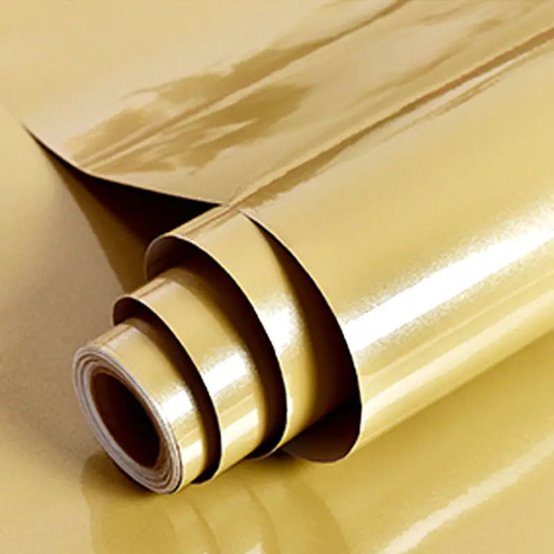 Roll of waterproof self-adhesive marble wallpaper in a golden yellow color