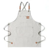 Light gray cotton canvas apron with cross-back straps and two patch pockets
