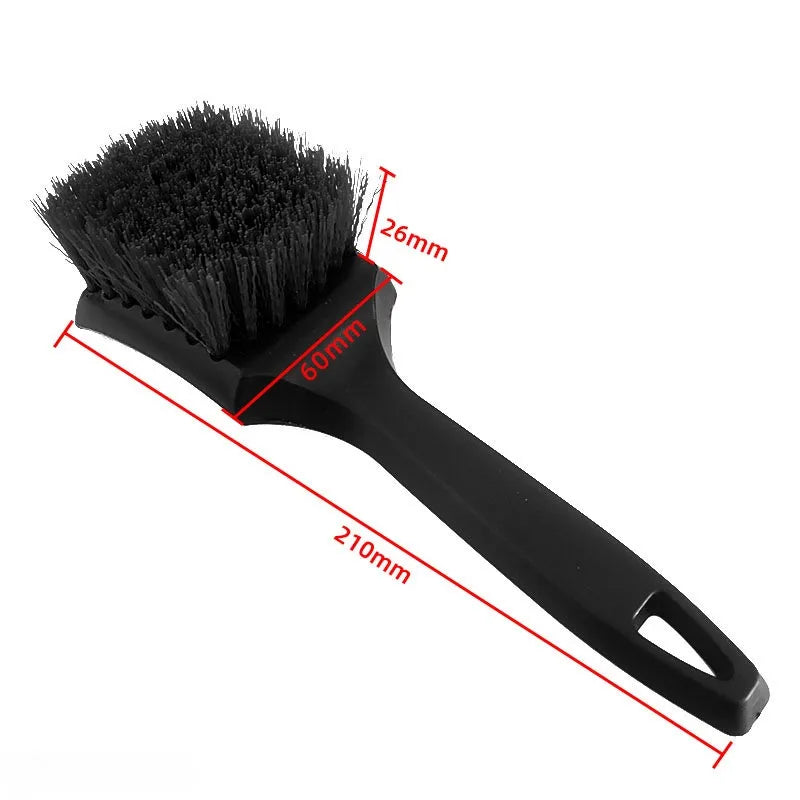 Black heavy-duty tire and wheel cleaning brush with a 26mm bristles and a 210mm handle.