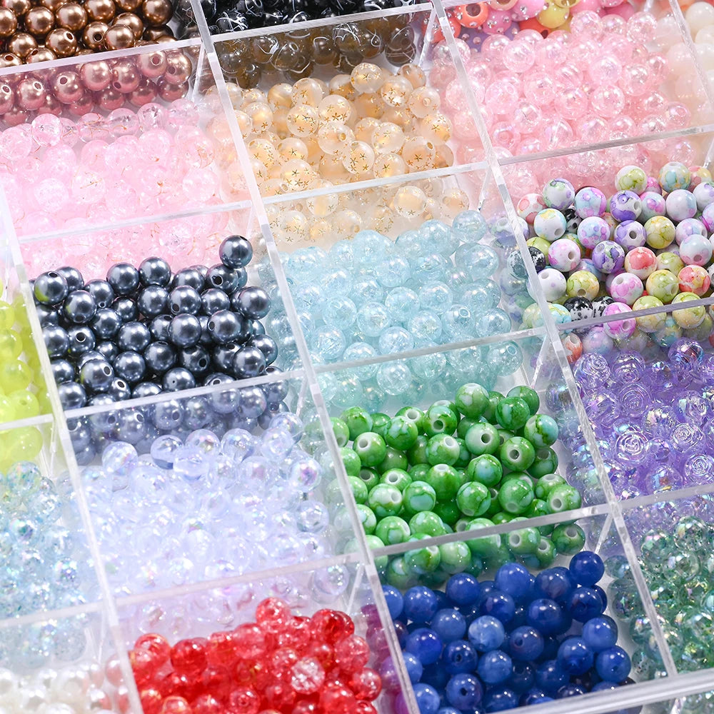 A collection of mixed acrylic beads in various colors and styles displayed in a blind box format for jewelry making