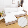 A beige sofa cushion cover with a white elastic edge is displayed on a light wood floor.