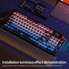 A close-up view of a backlit mechanical keyboard with luminous effects and a separate set of keycaps.