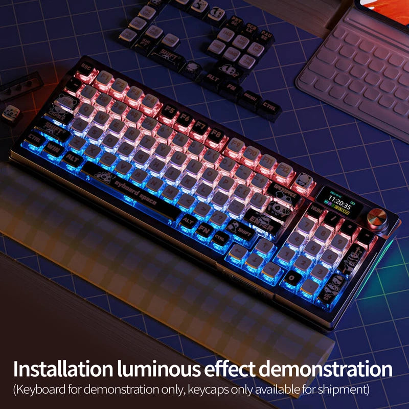 A close-up view of a backlit mechanical keyboard with luminous effects and a separate set of keycaps.
