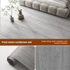 Roll of wood grain waterproof self-adhesive floor stickers in a gray tone