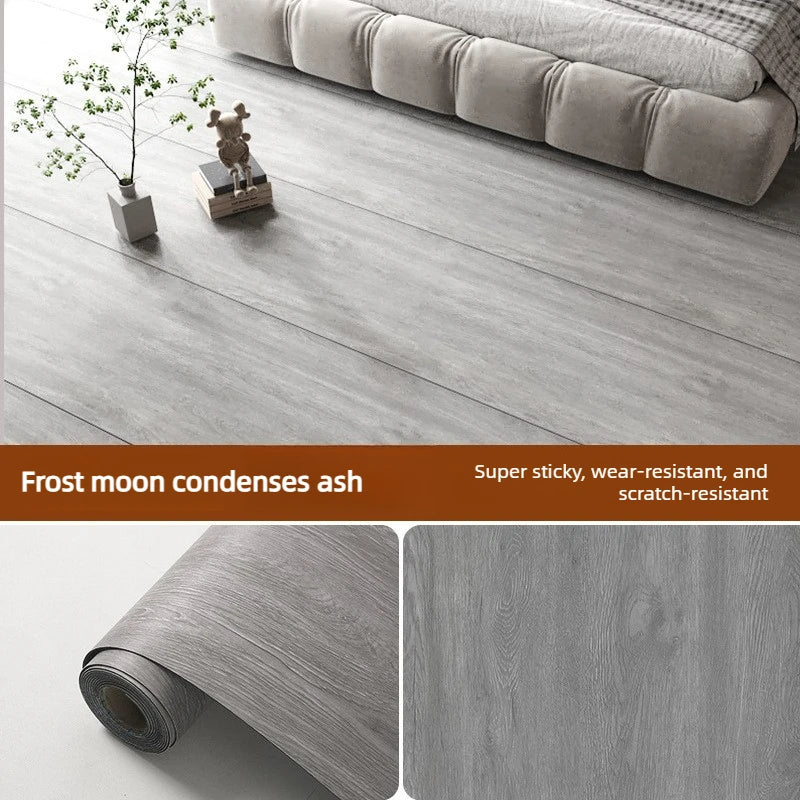Roll of wood grain waterproof self-adhesive floor stickers in a gray tone