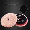 A close-up view of an orange microfiber polishing pad and a black polishing pad with hook and loop design.
