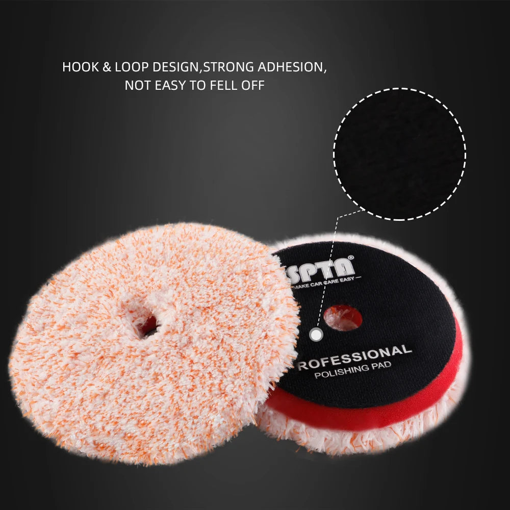 A close-up view of an orange microfiber polishing pad and a black polishing pad with hook and loop design.