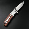 A folding pocket knife with a stainless steel blade and a walnut wood handle, shown in profile against a dark background.