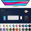 A desk pad featuring a monitor, smartphone, keyboard, mouse, and notebook, surrounded by various colored circles.