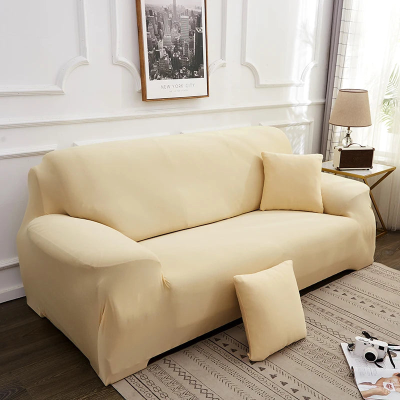 A light beige silky soft stretchable sofa cover for pet owners displayed on a modern living room sofa.