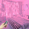 A pink bedroom decorated with LED curtain lights and a bed, with a hand holding a remote control.