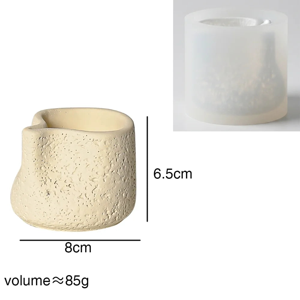 A light beige, wavy-edged silicone mold for concrete candle holders or plaster decor.