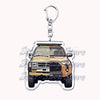 A durable metal keychain featuring a detailed model of an off-road truck.
