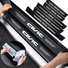 Black carbon fiber door sill protector stickers installed on a vehicle's side.
