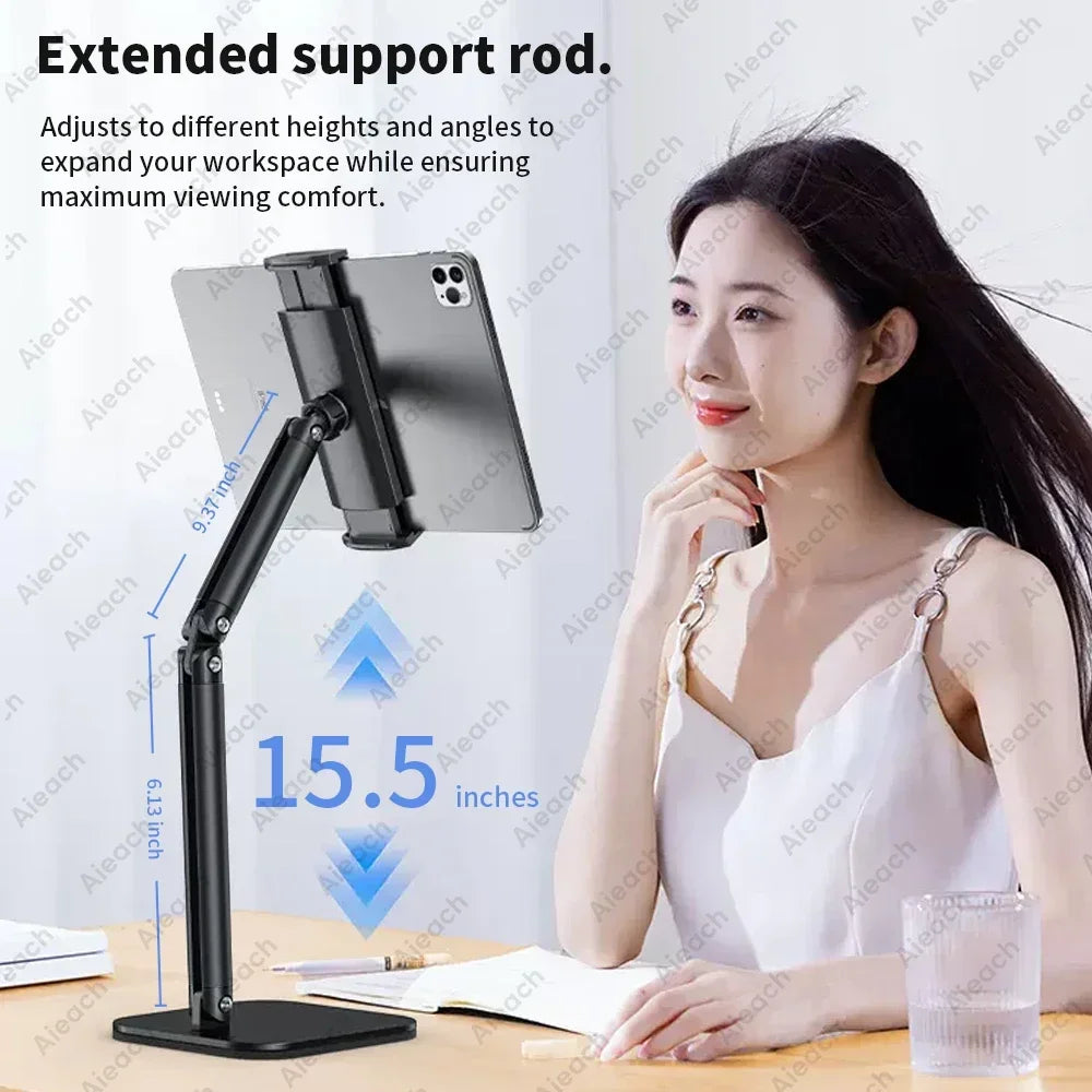 A woman is using an extended support rod adjustable metal tablet stand to position a 15.5-inch tablet for viewing comfort.
