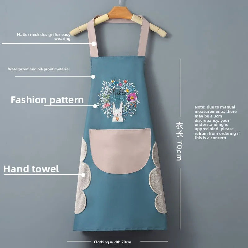 A teal waterproof kitchen apron with a floral pattern and a pocket is displayed on a hanger.