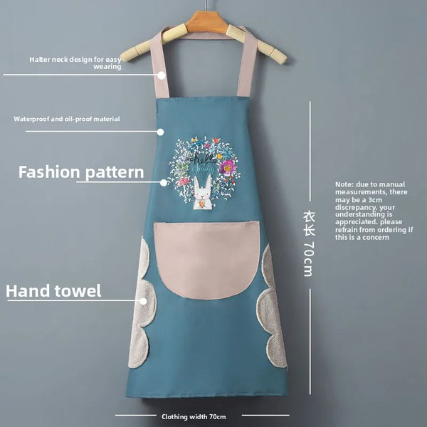 A teal waterproof kitchen apron with a floral pattern and a pocket is displayed on a hanger.
