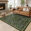A rectangular floral vine pattern carpet mat in green and pink tones placed on a light wood floor.