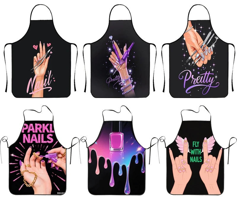 A set of black professional nail artist aprons featuring various glitter and pink nail art designs.