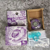 A packaging box for the Metal Fight Beyblade Rock Leone Premium Collector's Edition featuring a purple Beyblade and accessori