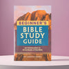 A book titled Beginner's Bible Study Guide with a cover featuring a mountain landscape.