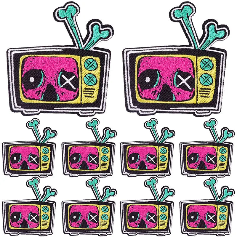 A set of ten embroidered iron-on patches featuring pink skulls with crossed eyes and horror themes.