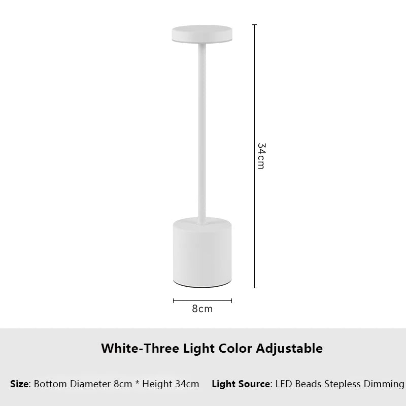White three light color adjustable table lamp with a cylindrical base and a round top.