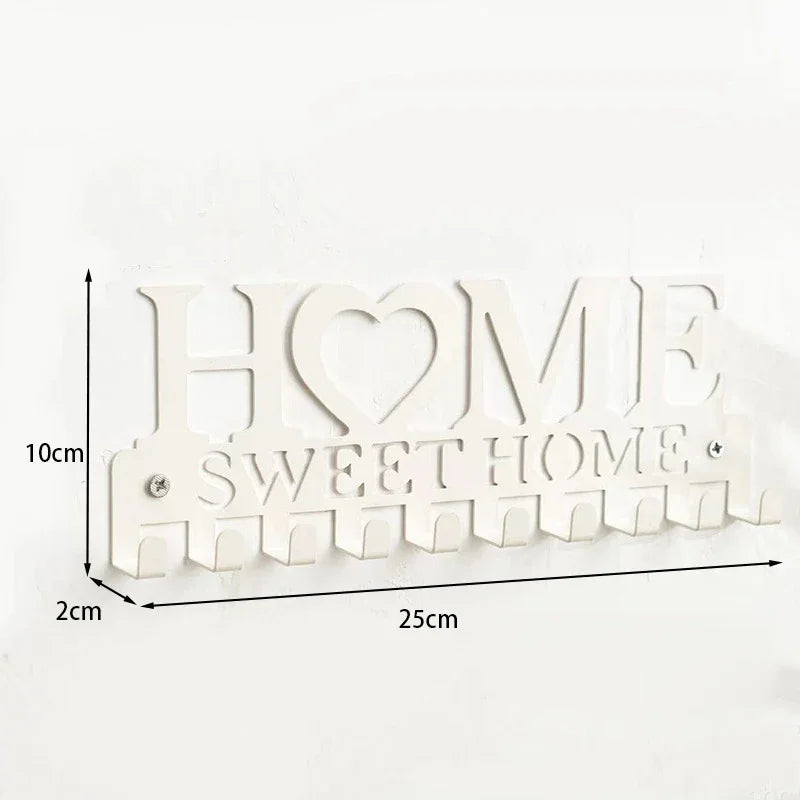 White wooden sign with the words HOME SWEET HOME and a heart design, featuring decorative serrated edges.