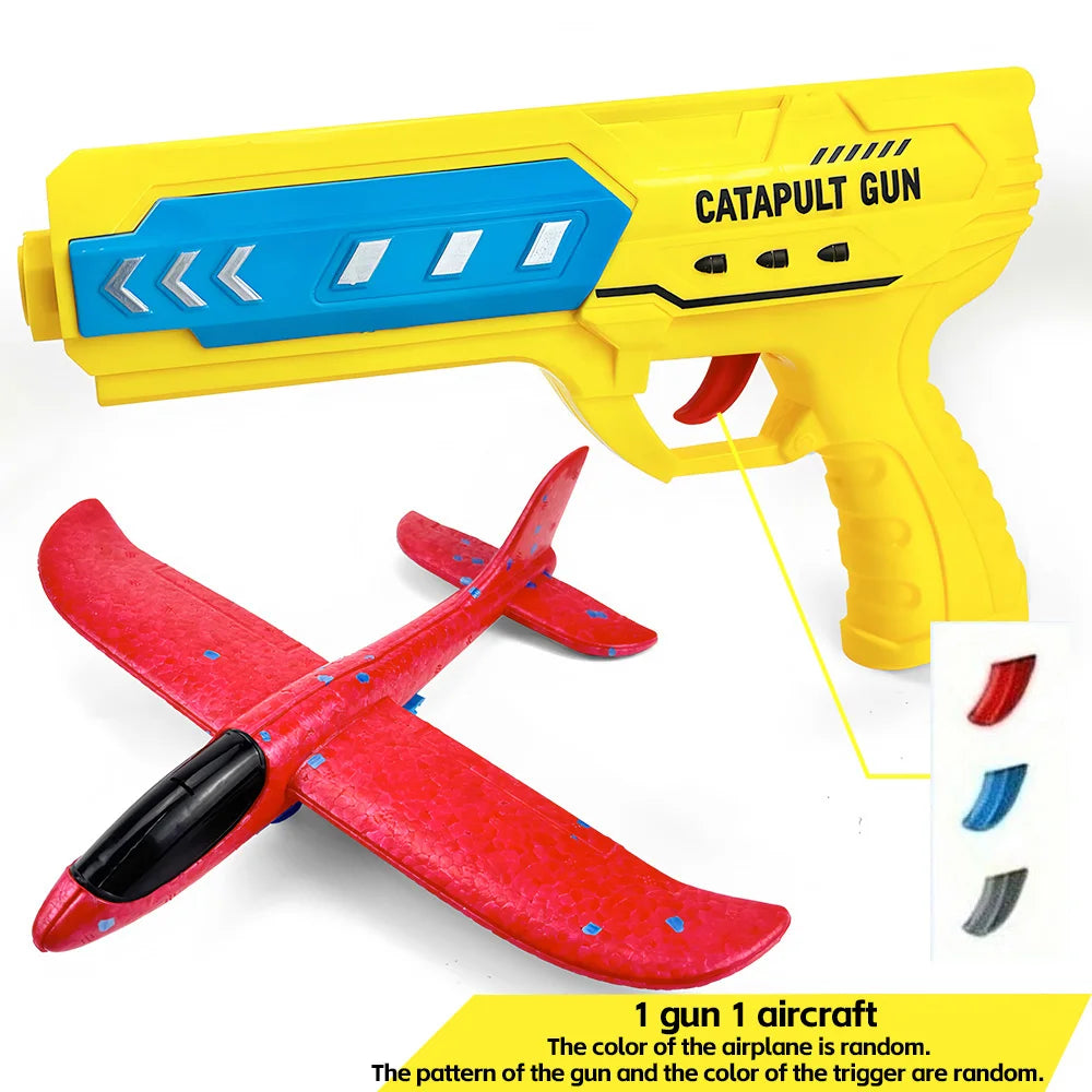 Yellow catapult gun and a red foam airplane are shown together.