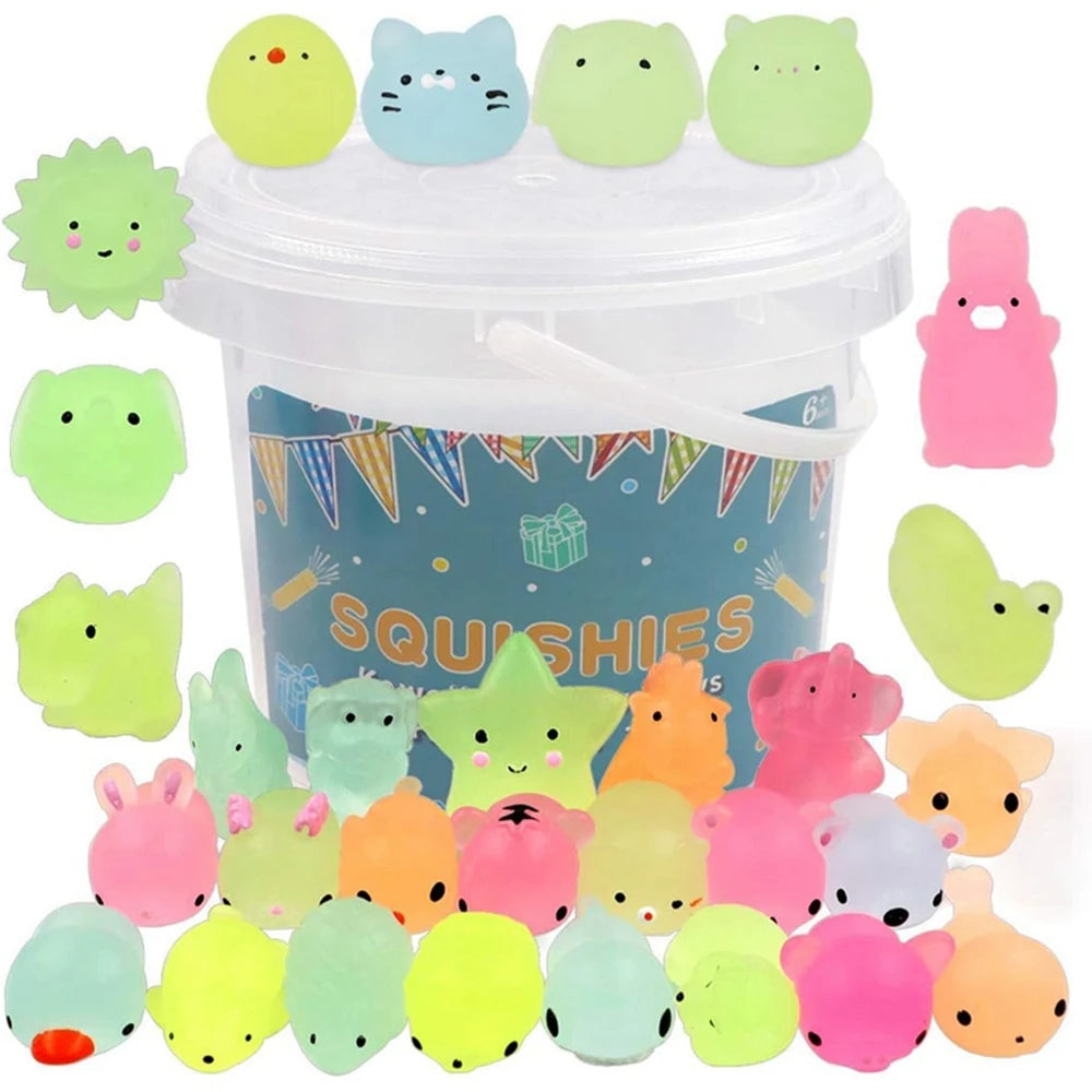 A collection of colorful squishy toys shaped like cats, bears, and other animals in a clear plastic container.