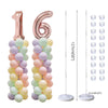 Two pink balloon columns with clear plastic stands for party decor