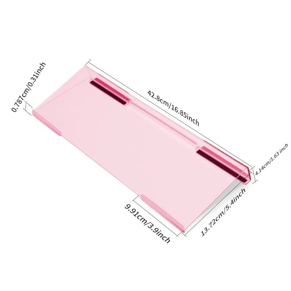 Pink acrylic ergonomic keyboard riser with a non-slip base shown from the side.