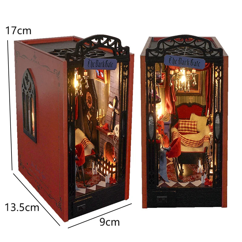 A wooden book nook kit featuring a dark gate design with internal lighting and miniature furniture.