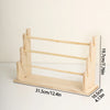 Solid wood ladder jewelry organizer with multiple storage tiers shown in a side view.