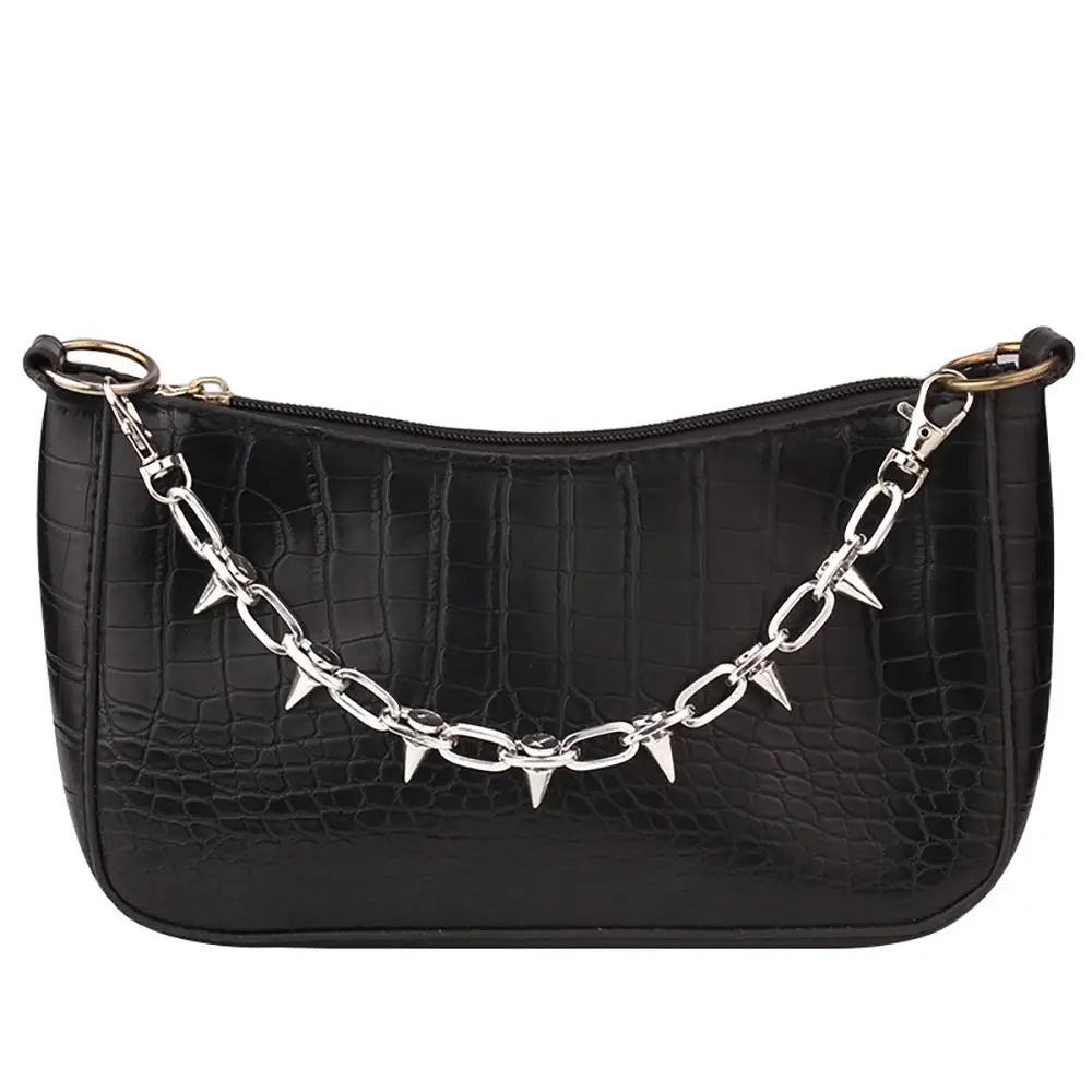 Black crocodile embossed leather handbag with a silver chain strap