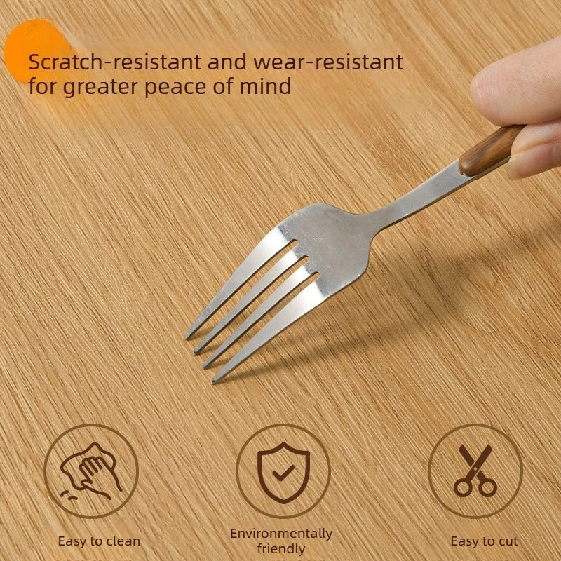 A silver fork is shown on a wooden surface with icons indicating it is scratch-resistant, easy to clean, environmentally frie