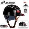 Black retro open face motorcycle helmet with a visor and a leather strap shown on a white background.