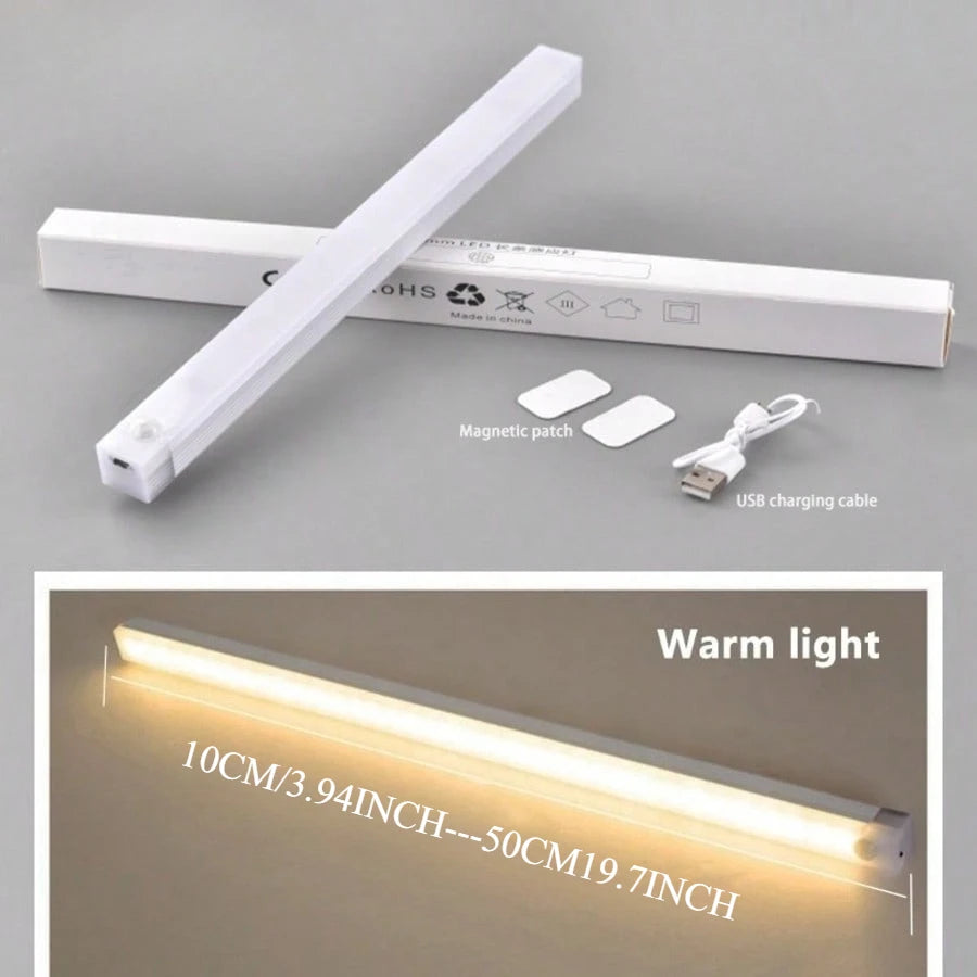 A white motion sensor LED night light bar with a USB charging cable and a warm light glow.