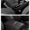 A black car armrest box mat with a storage pocket for Audi models is shown in the interior of a vehicle.