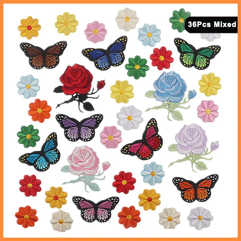A collection of 36 mixed butterfly and rose embroidered iron-on patches in various colors.