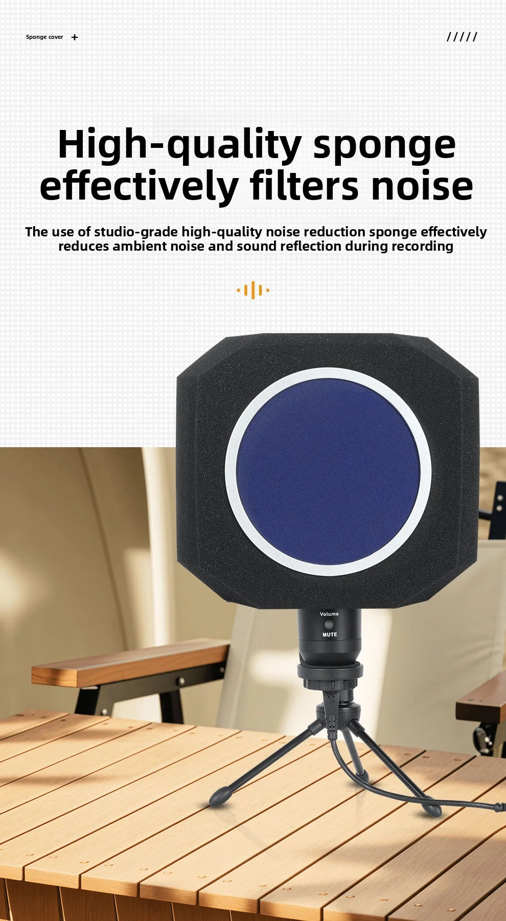 A black foam isolation shield with a blue circle is mounted on a stand, positioned above a wooden table.