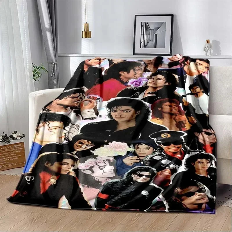 A printed flannel throw blanket featuring multiple portraits of Michael Jackson.