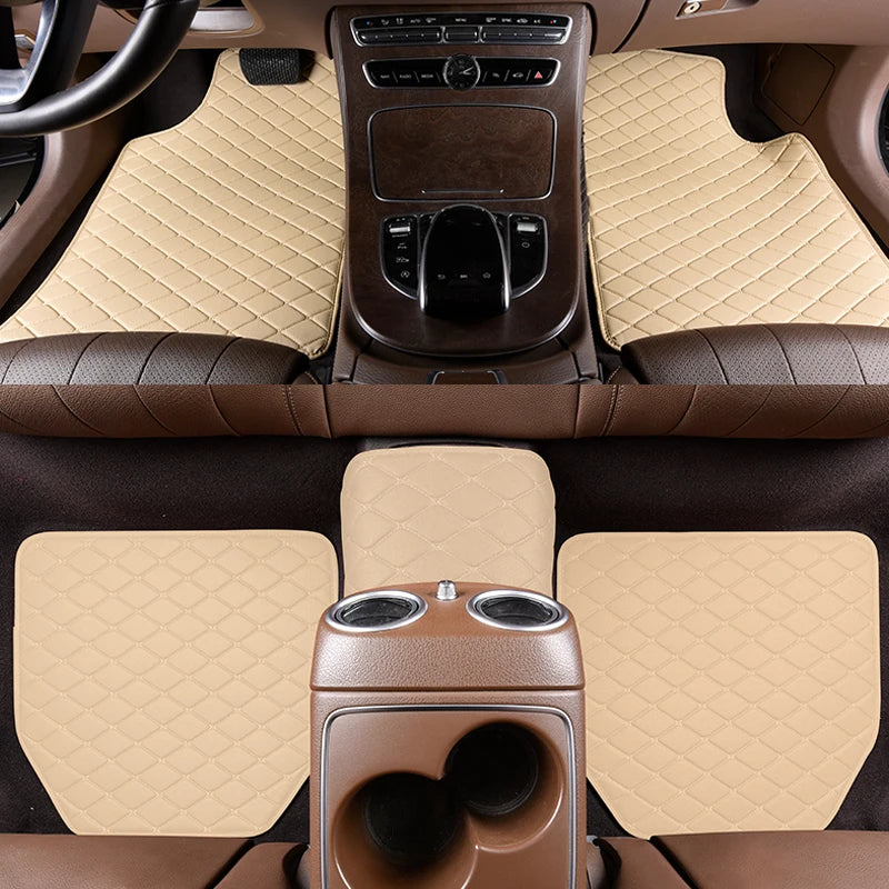 Interior view of a car with brown leather floor mats and beige textured carpeting.