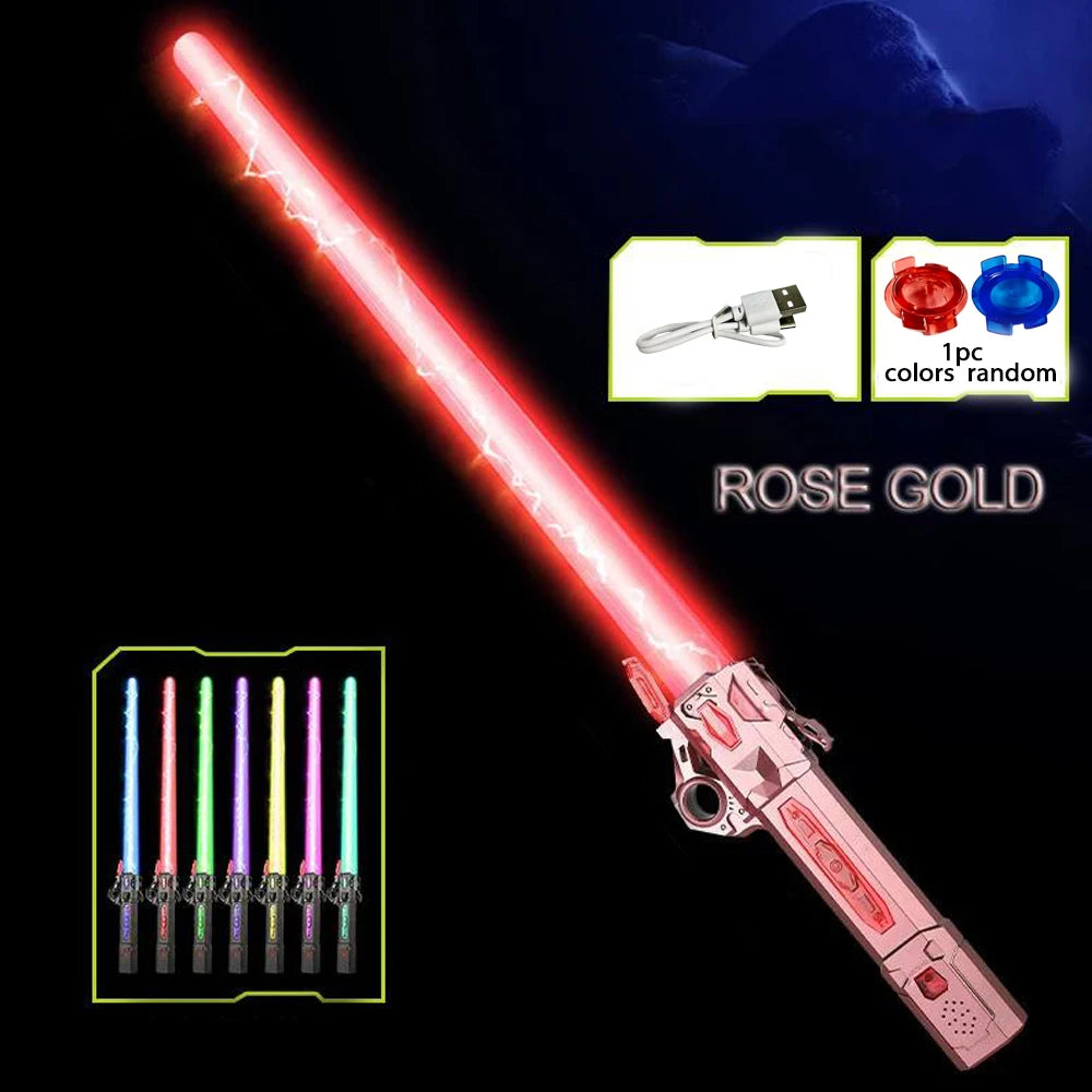 A pink and gold glowing musical toy sword with a telescoping blade and interchangeable lights.