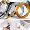 Rolls of decorative self-adhesive tile gap tape in various colors including black, silver, and gold.