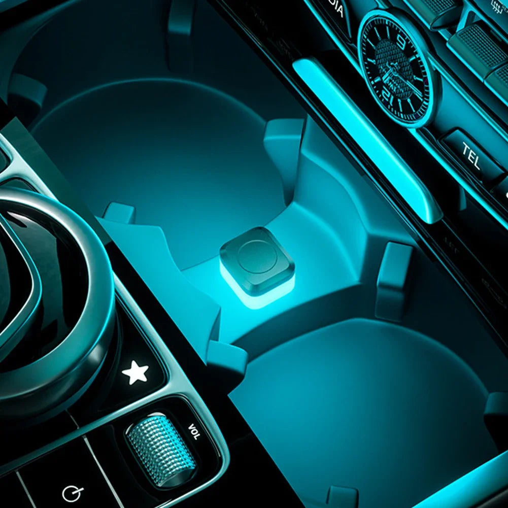 Close-up view of a USB powered compact LED car ambient light featuring blue illumination and controls.