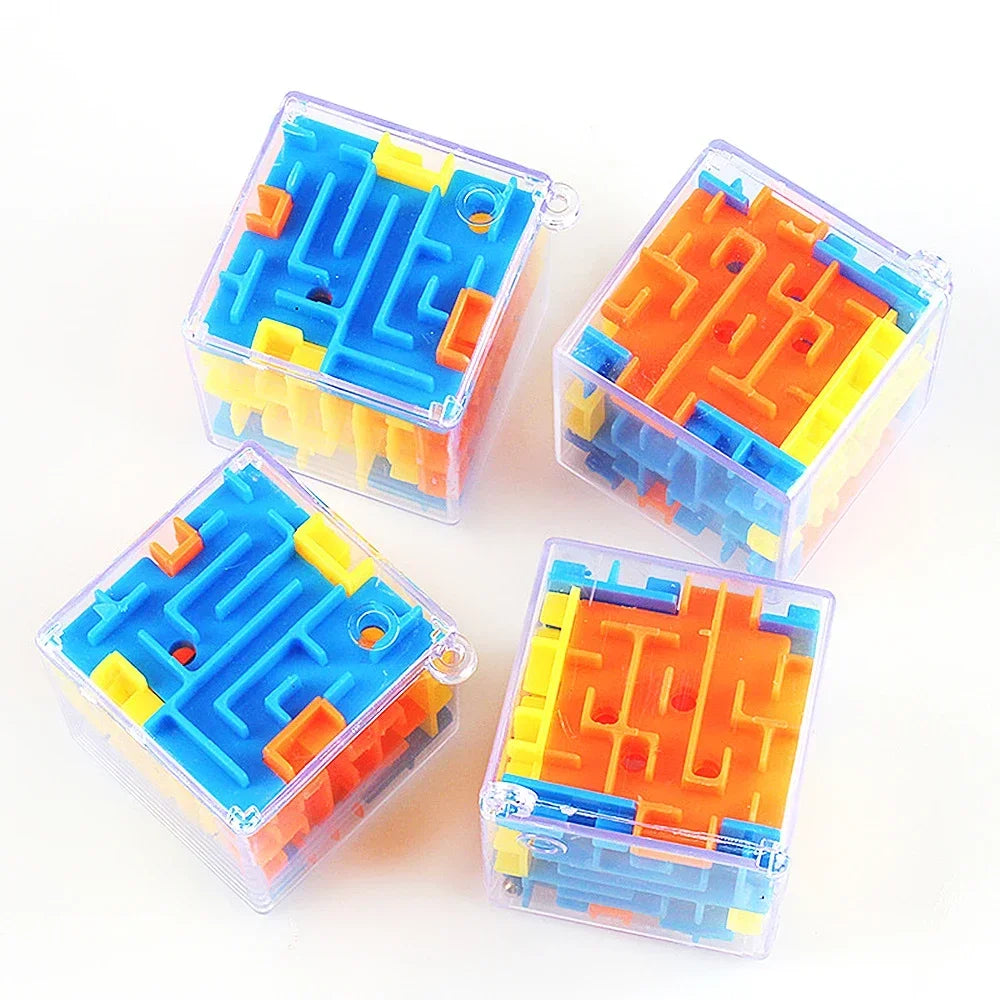 Three transparent plastic cubes filled with blue, orange, and yellow maze puzzle pieces.