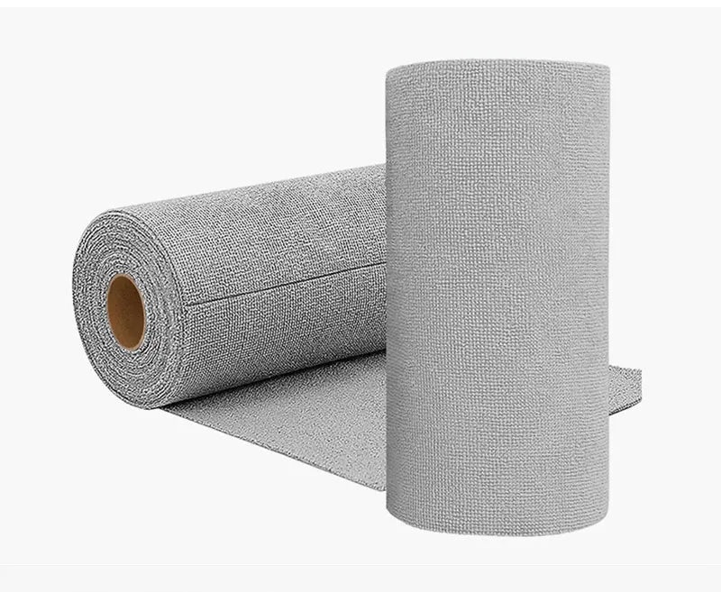 A roll of gray reusable microfiber cleaning towels standing next to a flat towel.