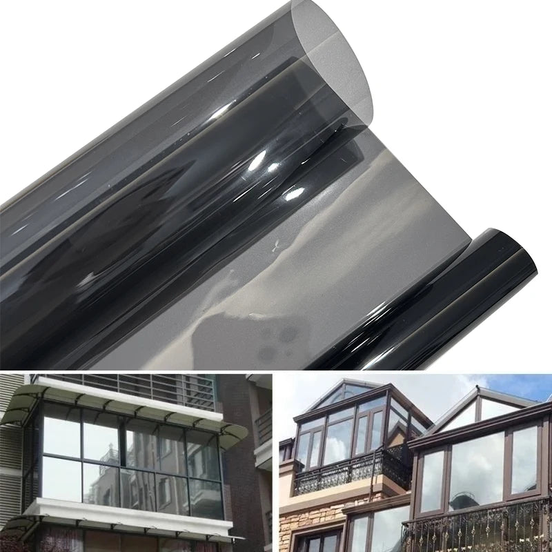 A close-up view of a rolled ceramic tint film, showing its smooth, dark gray surface and reflective finish.